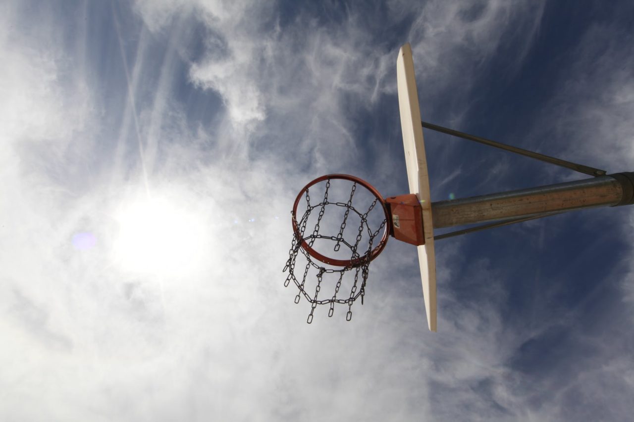 low angle photography of red and white basketball system